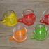 Glazen theekopjes met plastic houder van Melitta