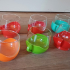 Glazen theekopjes met plastic houder van Melitta