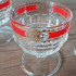 Vintage woestijnglas met rode bies gouden figuren