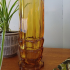 Vintage of retro glazen vaasje van bruin glas