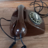 Vintage chocoladebruin telefoontoestel met draaischijf