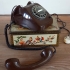 Vintage chocoladebruin telefoontoestel met draaischijf