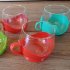 Glazen theekopjes met plastic houder van Melitta