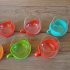 Glazen theekopjes met plastic houder van Melitta